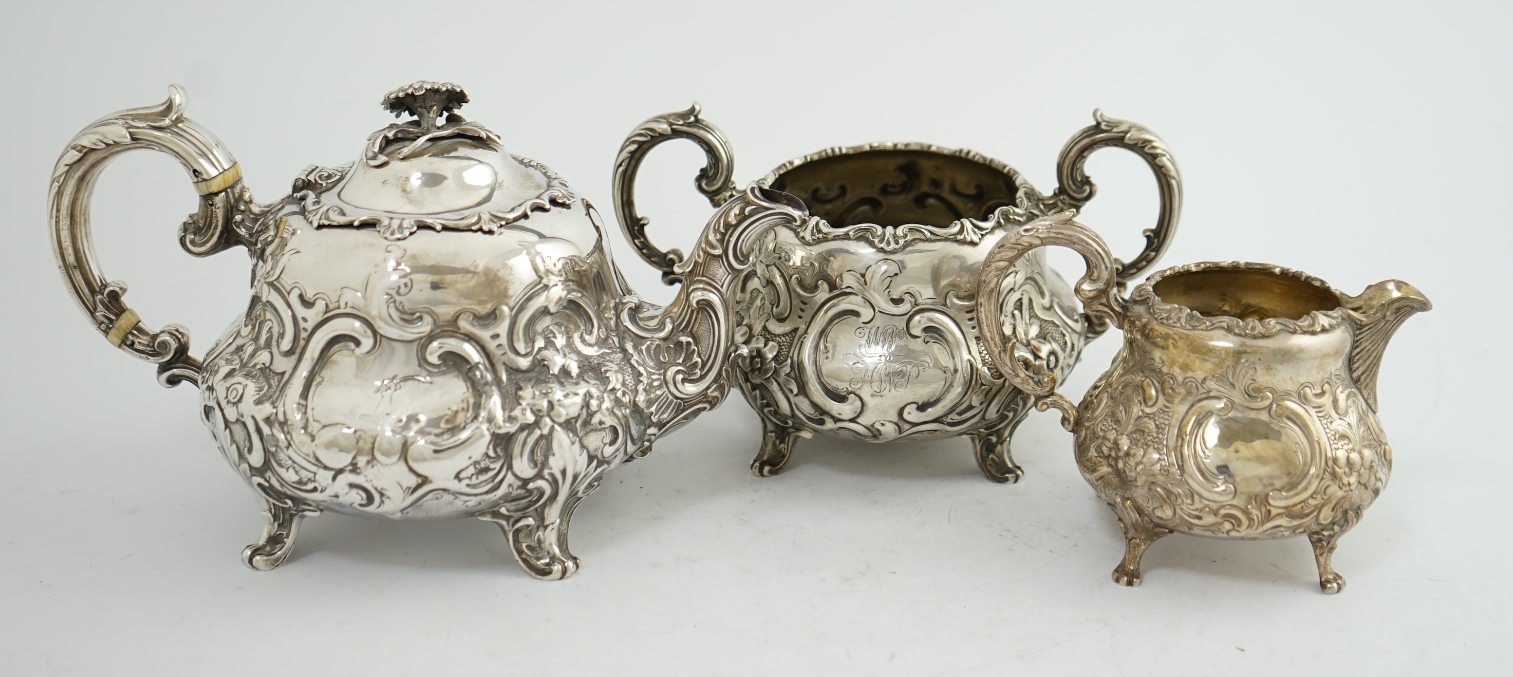 A matched Victorian and later silver three piece tea set